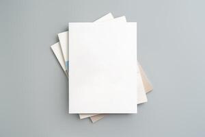 Empty White Sheet of Paper Positioned at an Angle on Light Gray Surface photo