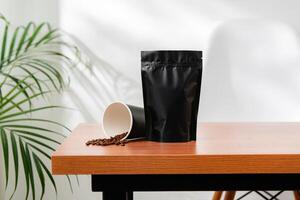 Three beverage containers and a paper bag on a wooden table photo