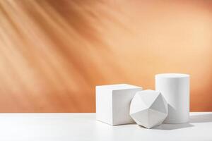 White geometric shapes arranged stylishly on a soft peach background in a minimalist setting photo