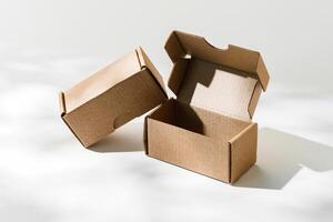 Open cardboard box on a reflective surface with soft shadows photo