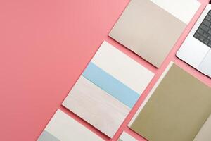 A Collection of Blank Papers Stacked on a Pink Surface for Creative Projects photo