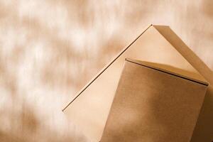 Stacked cardboard boxes on a neutral background in a shipping or packaging setting photo