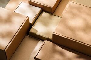 Stacked cardboard boxes arranged in a neat pattern under natural light photo