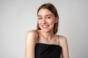 Smiling Young Woman Against White Background in Studio photo