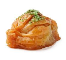 Delicious baklava topped with pistachio and honey, served as a dessert in a traditional setting photo