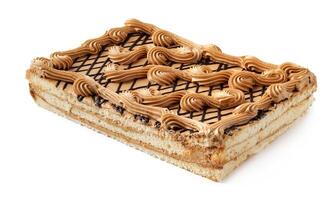 Layered dessert topped with decorative icing and chocolate drizzle on a white background photo