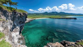 Stunning coastal view with clear turquoise water and rocky cliffs photo