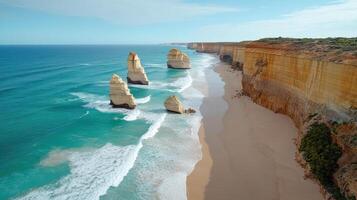Stunning view of Twelve Apostles along coastline with waves crashing photo