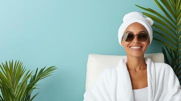 Relaxed woman in spa robe enjoying serene moment with plants photo
