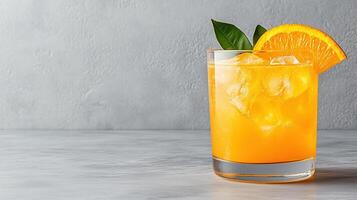 Refreshing glass of orange juice with ice and slice of orange photo
