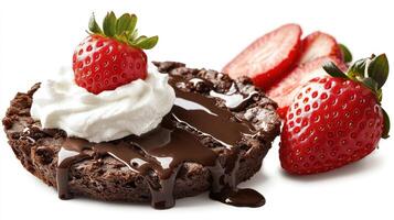 A decadent brownie with melted chocolate and strawberries awaits dessert lovers photo