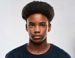 Portrait of African Teenager with Defined Defined Defined Shaved Curls on White Background photo
