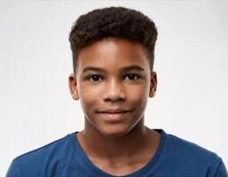 Studio Portrait of African Teenager with Defined Defined Defined Short Curls on White Background photo