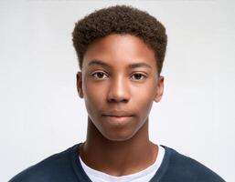 Close Up Portrait of African Teenager with Defined Defined Medium Natural Curls on White Background photo