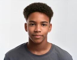 Portrait of African Teenager with Defined Defined Defined Short Natural Curls with Expression on White Background photo