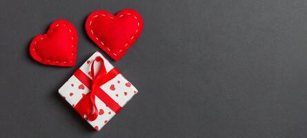 Top view of gift boxes and red textile colorful background. St Valentine's day concept with copy space photo