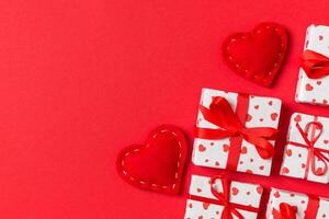 Holiday composition red textile hearts on colorful background with empty space for your design. Top view of Valentine's Day concept photo