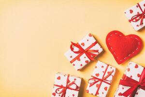 Top view gift boxes and red textile hearts colorful background. concept with copy space photo