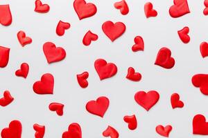 Valentine day background with red hearts top view photo