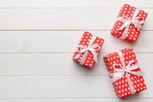Valentine day gift box with bow and heart. Christmas present. View from above. Space for text. Holday greeting card photo