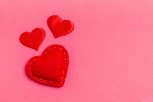 Top view of red textile hearts colorful background with copy space. Romantic concept. St Valentine's Day photo