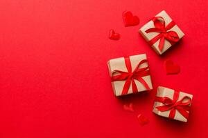 Valentine day composition red gift box with . Christmas present. View from above. Space for text. Holday greeting card photo