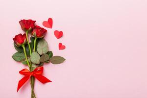 Valentine day with rose flower and red heart on table. Top view, flat lay, copy space Holiday concept photo