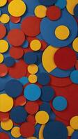 A lively pattern of circles and triangles in red, blue, and yellow, with plenty of space available for text or logos. photo