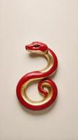 A sleek representation of the 2025 Chinese Zodiac snake in gold or red, placed on a neutral background, perfect for adding text or a logo. photo