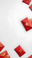 An empty red envelope hongbao is placed on a smooth white surface, offering a minimalist background ideal for adding text. photo