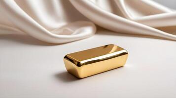 A single gold ingot rests on a smooth white silk background, surrounded by gentle light and a peaceful mood, leaving space for text. photo