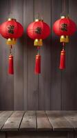 A weathered wood table displays two or three red lanterns, with enough space behind them to add Chinese New Year messages or logos. photo