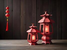 A pair of red lanterns lies on an old wooden table, providing a spacious background for the addition of Chinese New Year text or logo. photo