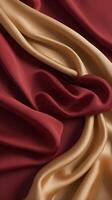 Silk fabric moves gently in shades of deep red and gold, creating a peaceful minimalist background with room for text. photo