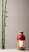 A serene composition of bamboo and a single red lantern, placed on a soft, muted background, with ample room for text or a brand message. photo