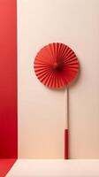 A subtle and elegant red paper fan on a soft cream-colored background, leaving space for text or a logo. photo