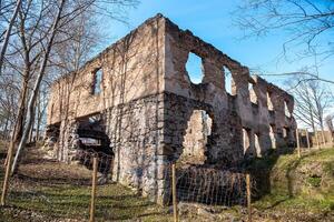 Ruins of a Rectangular Stone and Brick Structure with Bare Trees photo
