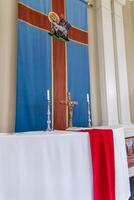 Religious Altar with Crucifix, Candles, and Christian Iconography photo