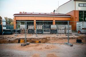 Active Construction Site with Modern Building and Wooden Facade photo