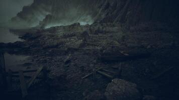 Rocky coastal landscape under a cloudy sky with weathered structures video