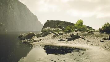 Serene riverside view in Portugal with rocks and tranquil water during daytime video