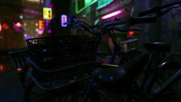 Bicycles parked in a colorful urban alley illuminated by neon lights video