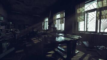 Sunlight filters through dusty windows in an abandoned workshop video