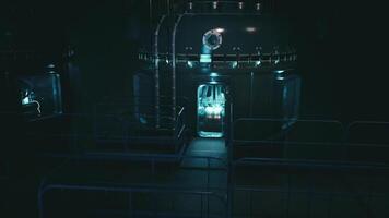 Exploring a dark futuristic laboratory with glowing equipment at night video