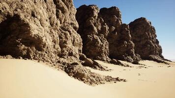 Group of Large Rocks on Sandy Beach video