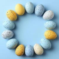 Colorful Arranged Eggs in a Circular Frame on a Light Blue Background for Celebrating Easter and Chinese New Year with a Minimalist Style photo