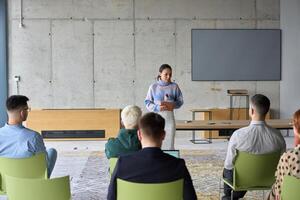 A businesswoman leader guiding a meeting with her colleagues, discussing business challenges, marketing strategies, and new plans for growth and success photo