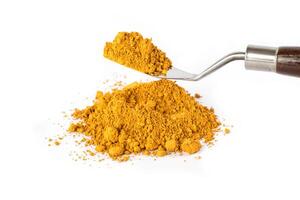 light ocher pigment Powder Spilled From a Container With a Smooth photo