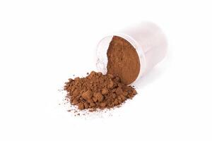 Cocoa Powder Spilled From a Container With a Smooth, Rich Texture on a Bright Background photo