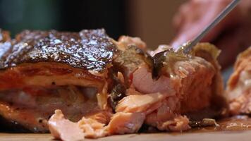 Close Up of Cooked Salmon Fillet Being Sliced with Knife and Fork video